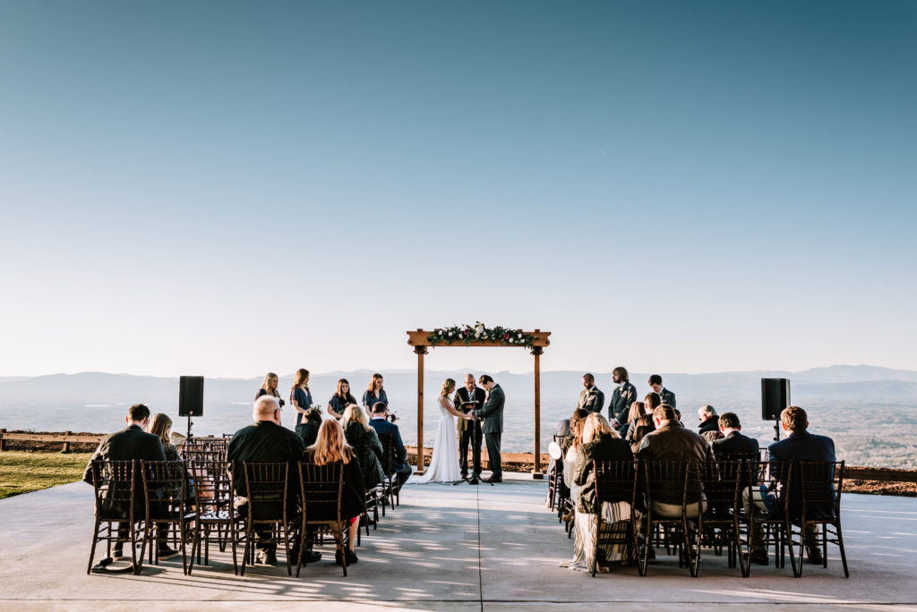 intimate wedding ceremony with the mountains in background
